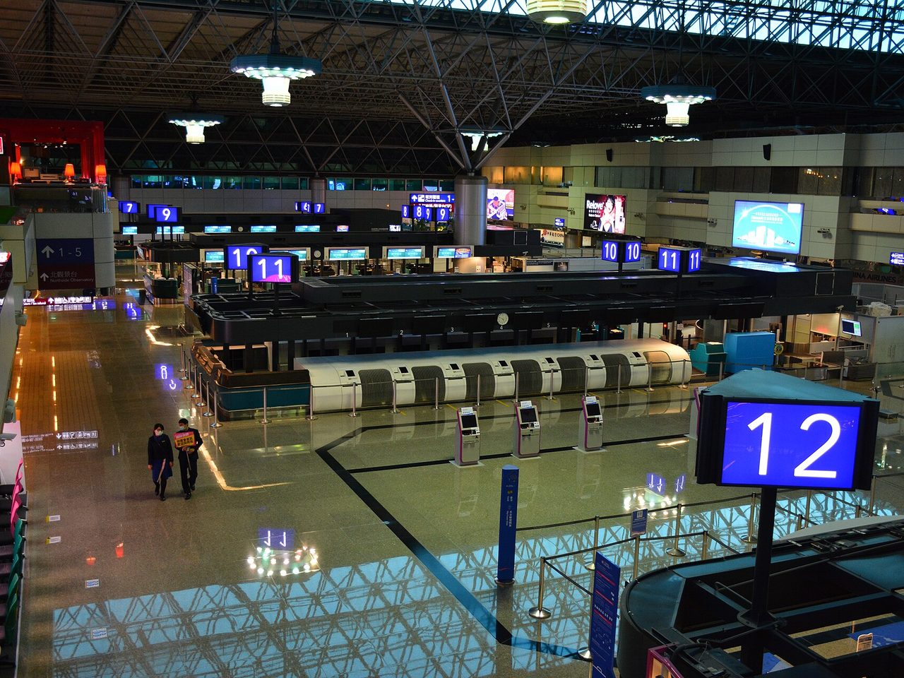 Quiet airport check-in hall early before departure
